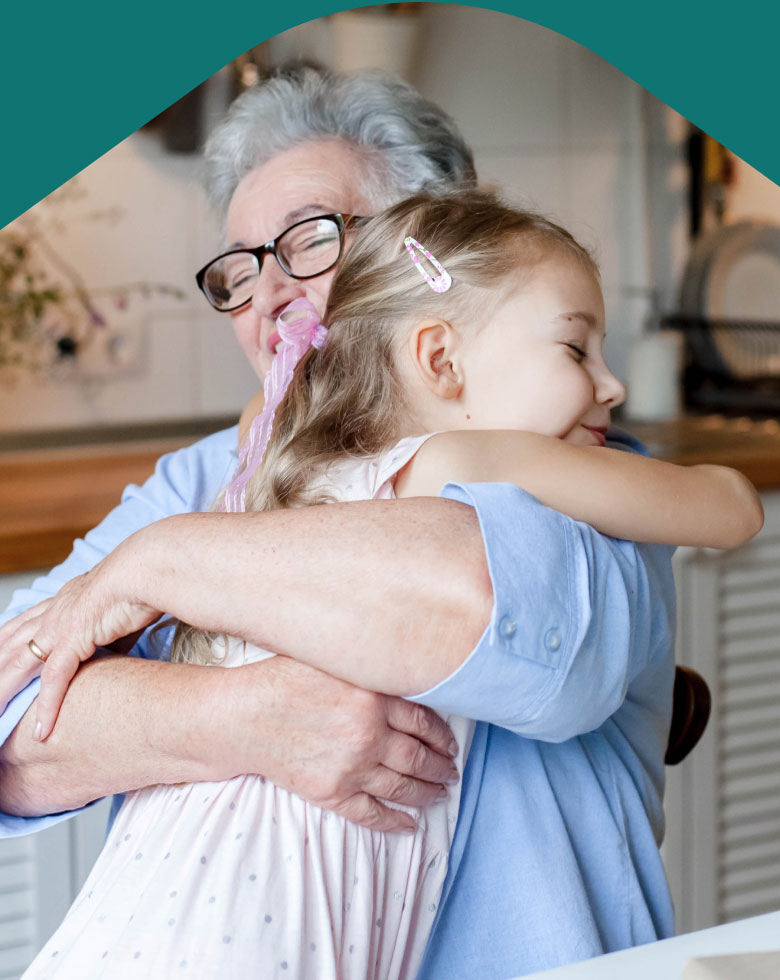Photo: Grandparent hugging child