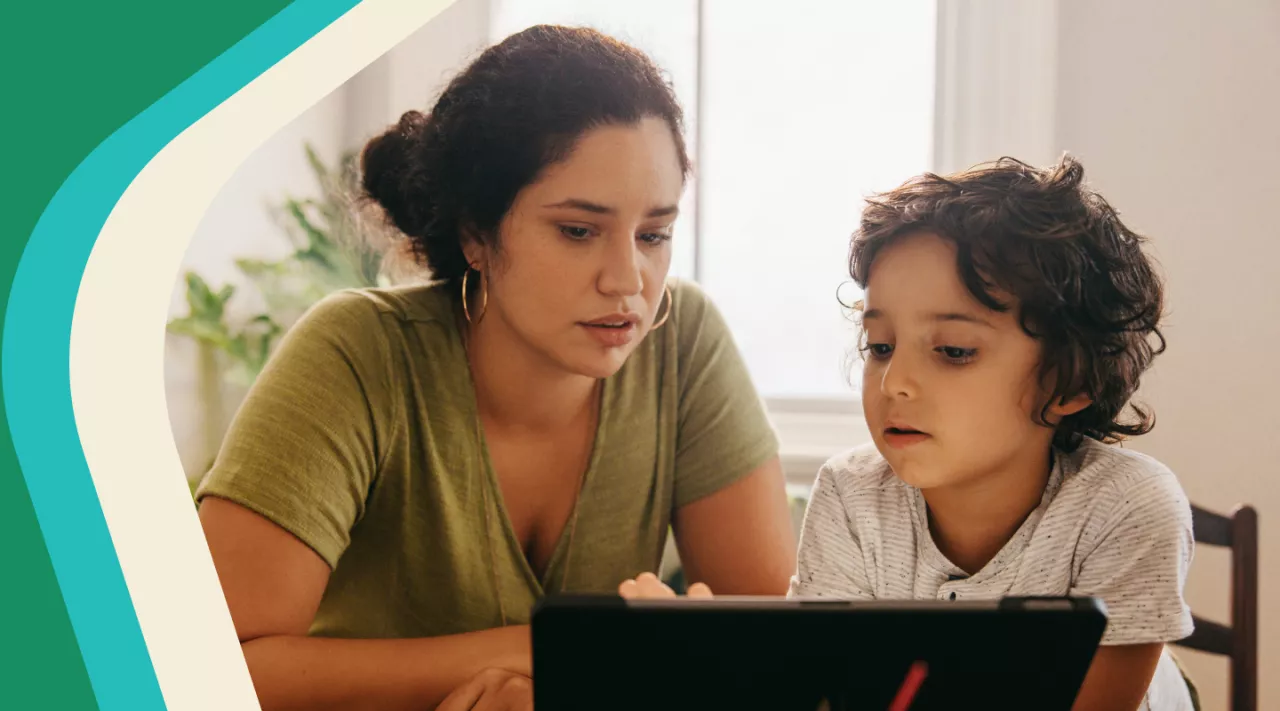 Photo: Mother and child looking at a tablet