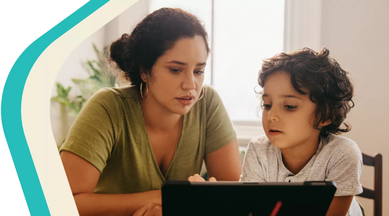 Photo: Mother and child looking at a tablet