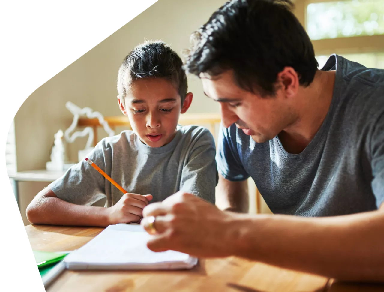 Photo: Father helping child with homework