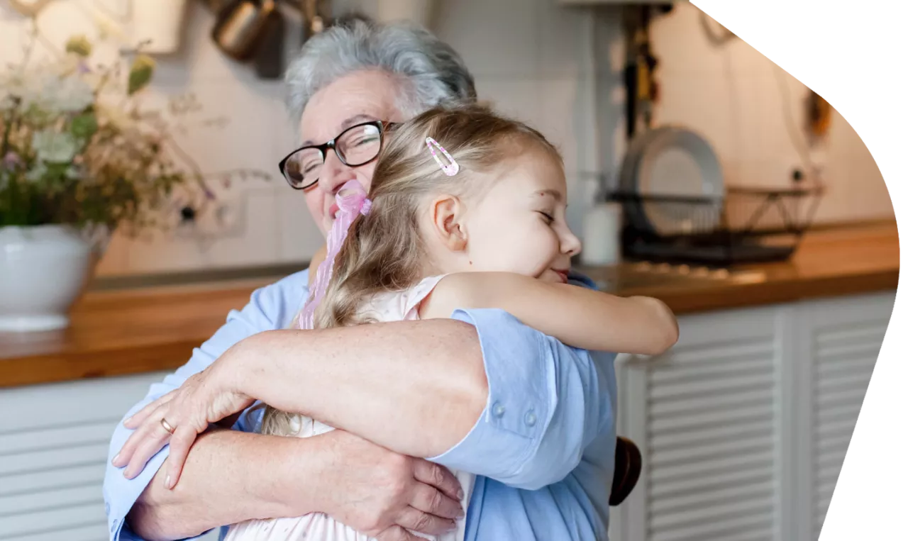 Photo: Grandparent hugging child
