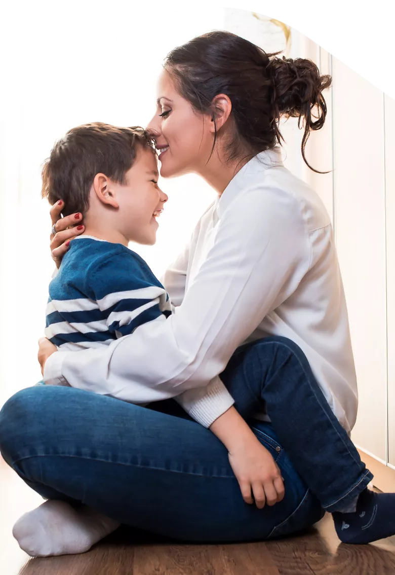 Photo: Mother hugging child