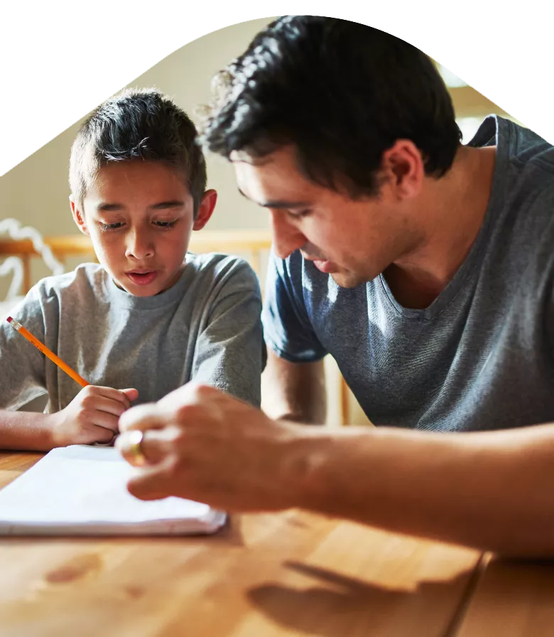 Photo: Father helping child with homework