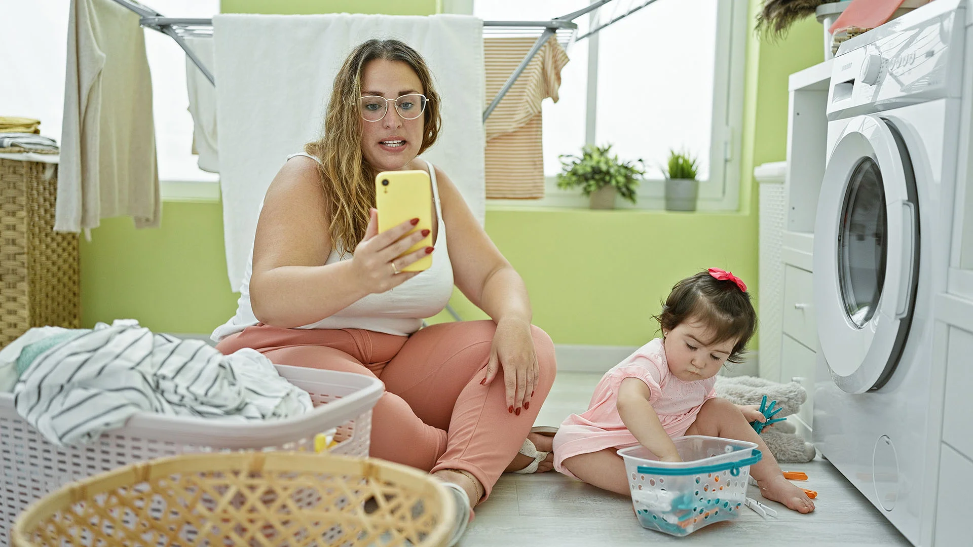 Parent/Guardian does laundry while using app for family mental health